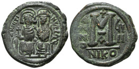 JUSTIN II (565-578). Follis. Nicomedia. Dated RY 9 (573/4).
Obv: D N IVSTINVS P P AVC.
Justin, holding globus cruciger, and Sophia, holding cruciform ...