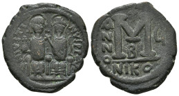 JUSTIN II (565-578). Follis. Nicomedia. Dated RY 6 (570/1).
Obv: D N IVSTINVS P P AVC.
Justin, holding globus cruciger, and Sophia, holding cruciform ...