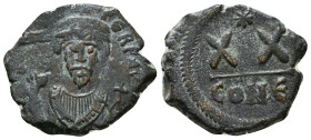 PHOCAS (602-610). Half Follis. Constantinople.
Obv: D N FOCAS PERP AVC.
Crowned bust facing, wearing consular robes and holding mappa and cross.
Rev: ...