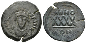 PHOCAS (602-610). Follis. Constantinople. Uncertain Date.
Obv: D N FOCAS PERP AVG.
Crowned bust facing, holding mappa and cross(?).
Rev: Large XXXX; A...
