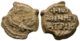 Byzantine Lead Seal.
John , Patrikios, eagle
Av.: Eagle with uplifted wings and head turned to right. In field above head of eagle, invocative monog...