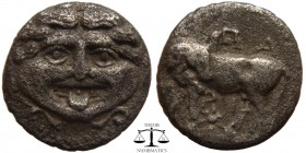 Mysia, AR Drachm Parion 400-300 BC. Head of Gorgoneion facing, tongue protruding, serpents around head. / ΠA-ΡI above and beneath bull standing left, ...