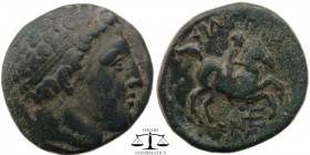 Philip II Kings of Macedonia, AE19 323-317 BC. Head of Apollo right, hair bound in a taenia / ΦIΛIΠΠOY, youthful rider on horseback right. NE monogram...