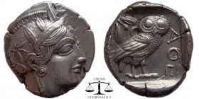 Attica, Athens AR Tetradrachm after 449 BC. Helmeted head of Athena right / AΘE, owl standing right; olive-sprig and crescent above. SNG Cop 39. 26 mm...