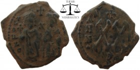 Phocas & Leontia AE Half Follis Antioch 602-610 AD. ON FOCA NEPE AV, Phocas on left, holding cross on globe and Leontia on right, holding sceptre topp...