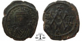 Maurice Tiberius AE Half follis Antioch 582-602 AD. blundered legend, bust facing, wearing crown with trefoil ornament, and consular robes; in right h...