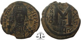 Justinian I AE Follis Antioch 527-565 AD. DN IVSTINIANVS PP AVG, helmeted and cuirassed bust facing, holding cross on globe and shield with horseman m...