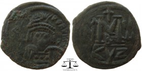 Heraclius AE Follis Cyzicus 610-641 AD. blundered or fragmentary legend, helmeted, diademed, and cuirassed facing bust, holding cross and shield / Lar...