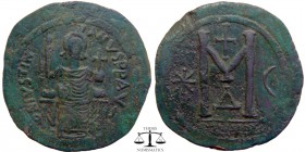 Justinian I AE Follis Theoupolis (Antioch) 546-551 AD. DN IVSTINI-ANVS PP AVG, Justinian seated facing on throne, holding sceptre and cross on globe /...