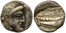 PHOENICIA. Arados. Uncertain king. Circa 400-384 BC. 1/16 Shekel (silver, 0.71 g, 9 mm). Laureate head of Ba'al-Arwad right. Rev. Galley right, above ...