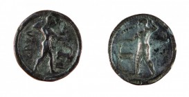Bruttium 
Caulonia - Nomos databile al periodo 525-500 a.C. - Diritto: Apollo in cammino verso destra tiene un ramo di alloro con la mano destra alza...