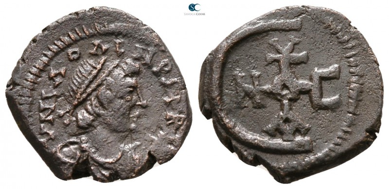 Justinian I. AD 527-565. Theoupolis (Antioch)
Pentanummium Æ

15 mm., 1.77 g....