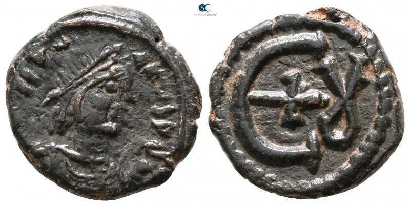 Justinian I. AD 527-565. Theoupolis (Antioch)
Pentanummium Æ

15 mm., 2.76 g....