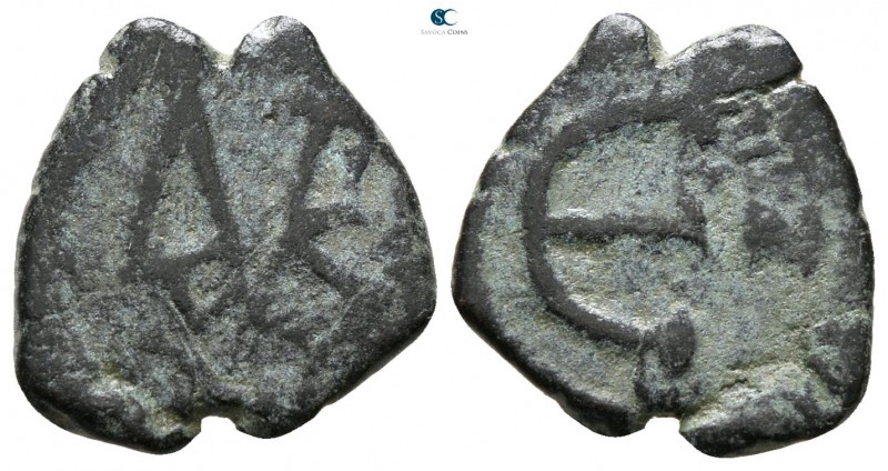 Justin II AD 565-578. Constantinople
Pentanummium Æ

15 mm., 1.51 g.



f...