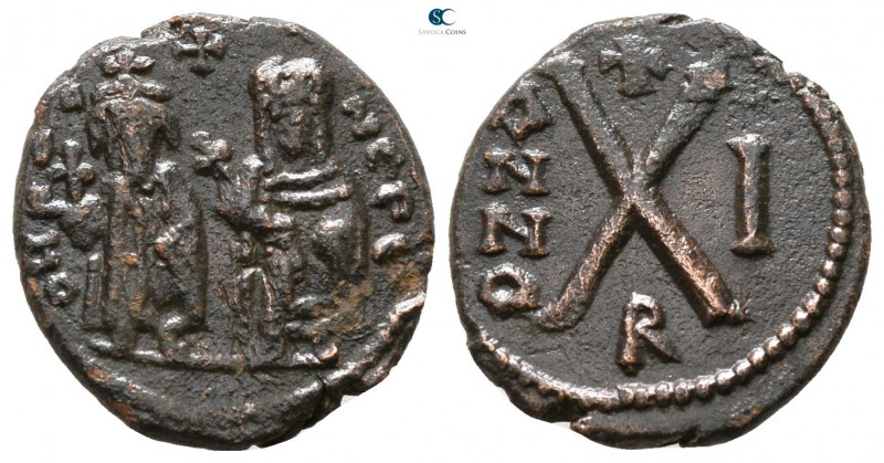 Phocas, with Leontia AD 602-610. Theoupolis (Antioch)
Decanummium Æ

15 mm., ...