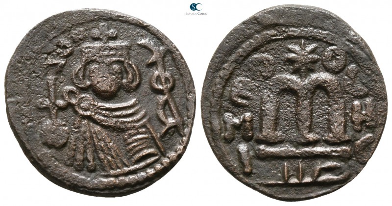 Umayyad Caliphate circa AD 660-690. 
Fals (Follis) Æ

20 mm., 3.07 g.



...