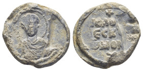 Byzantine Lead Seal, (19mm, 5.3 g) Nimbate facing bust of Saint. / Legends in three lines.