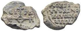 Byzantine Lead Seal, (28mm, 11.5 g) cruciform monogram;. / Legends in four lines.