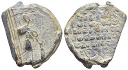 Byzantine Lead Seal, (30mm, 24.6 g) Nimbate military saint (Georgios?) standing facing, holding spear and shield. / Legends in six lines.