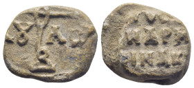 Byzantine Lead Seal, (20mm, 10.2 g) cruciform monogram;. / Legends in three lines.