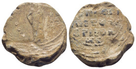 Byzantine Lead Seal, (23mm, 15.7 g) Saint standing facing. ./ Legends in four lines.