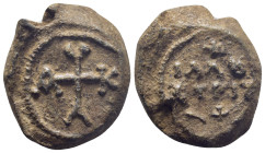 Byzantine Lead Seal, (26mm, 18.6 g) cruciform monogram;. / Legends in three lines.