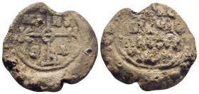 Byzantine Lead Seal, (29mm, 19.2 g) cruciform monogram;. / Legends in four lines.