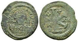 JUSTINIAN I (527-565). Antioch. Half Follis.
Obv : D N IVSTINIANVS P P AVG.
Helmeted, draped and cuirassed bust facing, holding globus cruciger and sh...