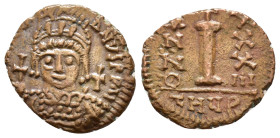 JUSTINIAN I.527-565 AD.Antioch mint.AE Decanummium. DN IVSTINIANVS PP AVG, helmeted, cuirassed bust facing, holding cross on globe and long sceptre, c...