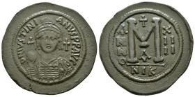 JUSTINIAN I.(527-565).Nicomedia.Follis.
Obv : DN IVSTINIANVS PP AVG.
Helmeted, cuirassed bust facing, holding cross on globe and shield with horsema...