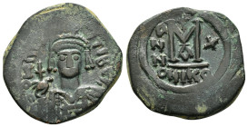 "MAURICE TIBERIUS. 582-602 AD.Nicomedia mint.AE Follis.DN MAVRIC TIbER PP A, helmeted and cuirassed or crowned and cuirassed bust facing, holding cros...