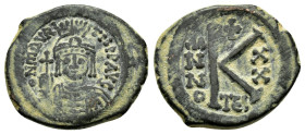 MAURICE TIBERIUS (582-602). Half Follis. Thessalonica.
Obv: D N TIb mAVRC P P AVC.
Crowned and cuirassed bust facing, holding globus cruciger and sh...