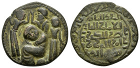 ARTUQID of MARDIN.Husam al Din Yuluq Arslan.(1184-1201).No Mint.589 AH.AE Dirhem.
Obv : Three standing figures around central female figure seated lef...