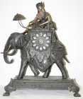 Uhren
Sonstige Uhren
Große Kaminuhr in Form eines berittenen Elefanten. Wohl Frankreich, 19. Jh. Zink geschwärzt und in Teilen bronziert. Höhe 53 cm...