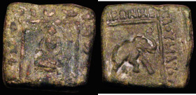 Indo-Scythian Maues Ae Hemiobol, rectangular flan 22mm x 20mm, (c.90-57BC) Obverse: King seated, cross-legged on couch, rectangular border, monogram a...