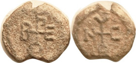 LEAD SEAL, 23 mm, 7th-8th centuries? Cruciform monogram each side, F-VF, top & bottom edge irregularities, sl rough, but centered, complete & clear.