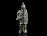 A ROMAN BRONZE GLADIATOR BROOCH 
Circa 2nd-3rd century AD.
The brooch features a secutor standing front with his typical smooth-crested helmet and lar...