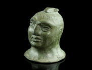 A ROMAN BRONZE BUST OF A BOXER
Circa 3rd century AD.
Bust with the characteristic features of a professional boxer, notably the very short hair with t...