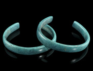 A PAIR OF EUROPEAN LATE BRONZE AGE BRACELETS
Circa 1000-800 BC.
A matching pair of bronze bracelets, the rod rectangular in section. A few remains of ...