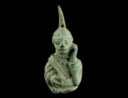 A ROMANESQUE BRONZE FIGURE OF ST JOHN MOURNING
Circa 12th century AD.
St John the Evangelist is shown in a long robe, touching his face with the left ...
