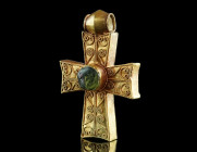 A FINE EARLY BYZANTINE DECORATED GOLD CROSS
Circa 5th-7th century AD.
Highly elaborate gold cross with filigree decoration and a central projecting me...