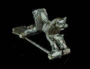 A ROMAN BRONZE LION BROOCH
Circa late 1st-2nd century AD.
Rare brooch with trapezoid foot and a bow composed of two elaborately worked lion protomes b...