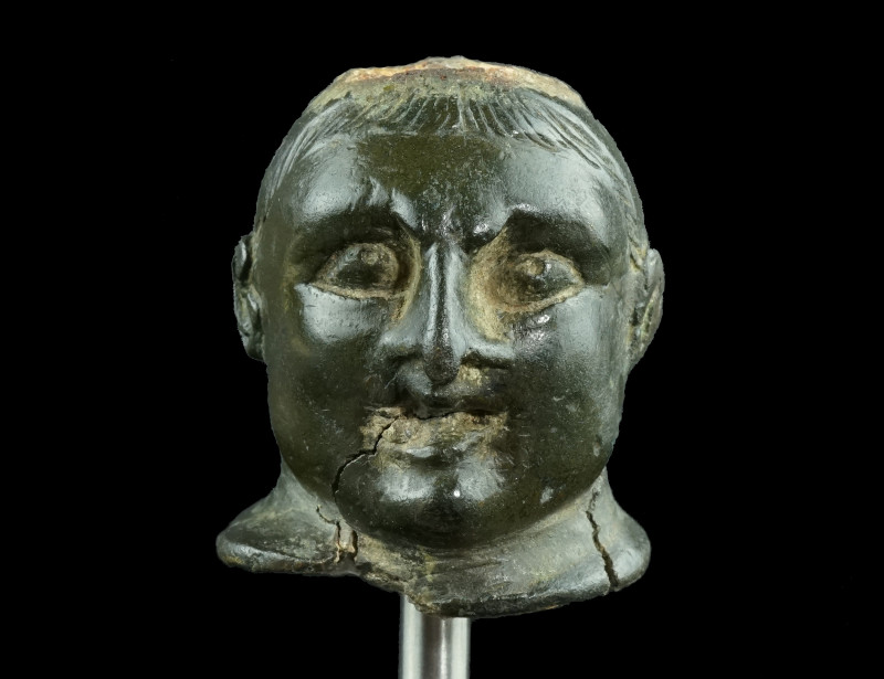 A ROMAN BRONZE BUST OF AN ATHLETE
Circa 2nd-3rd century AD.
Steelyard weight in ...