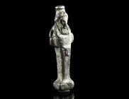 A ROMAN SILVER PENDANT IN THE SHAPE OF A HERM
Circa 1st-3rd century AD.
Miniature four-cornered pillar surmounted by a male bust with modius (probably...