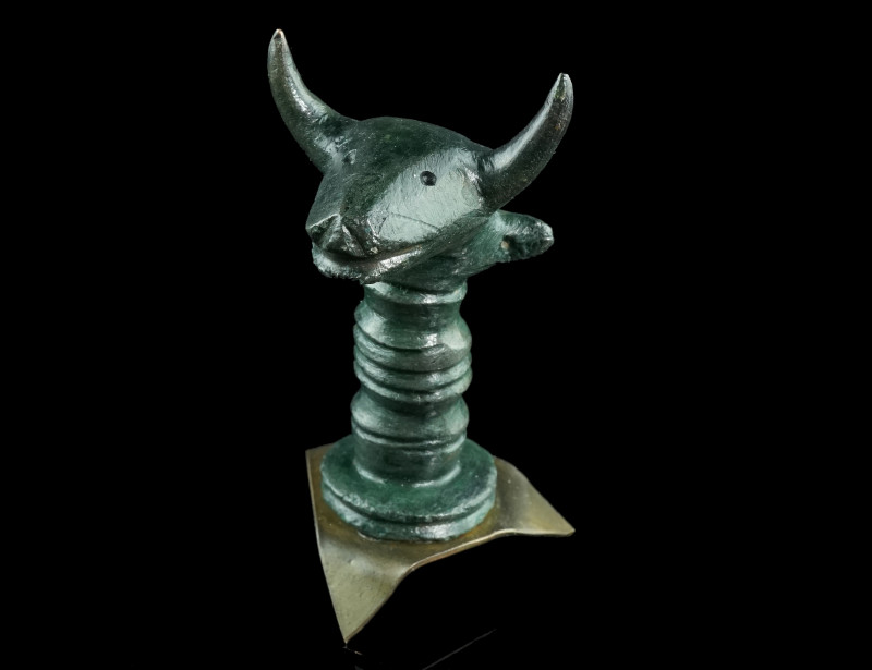 AN IRON AGE/CELTIC BRONZE HEAD OF A BULL
Circa 5th-3rd century BC.
Solid cast pr...
