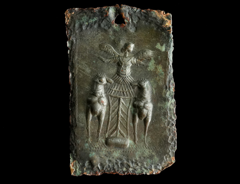 A GREEK BRONZE PLAQUE WITH A WINGED GODDESS
Circa 5th-3rd century BC.
Rectangula...