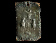 A GREEK BRONZE PLAQUE WITH A WINGED GODDESS
Circa 5th-3rd century BC.
Rectangular bronze plaque worked in repoussé, depicting a winged goddess standin...