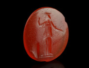 A ROMAN CARNELIAN INTAGLIO DEPICTING MINERVA
Circa 1st-3rd century AD.
Oval intaglio with the helmeted and draped goddess standing facing, head to rig...