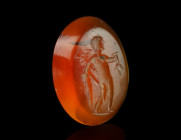 A ROMAN CARNELIAN INTAGLIO DEPICTING MERCURY
Circa 1st-3rd century AD.
Oval intaglio with the nude god standing facing, head to right, herald's staff ...