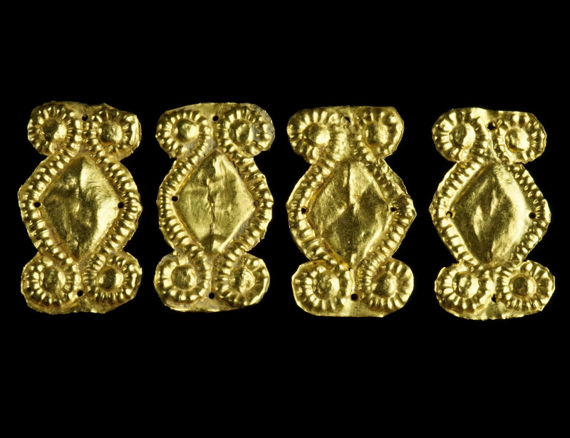 A GROUP OF FOUR GREEK GOLD ORNAMENTS
Circa 5th-4th century BC.
Dress ornaments m...